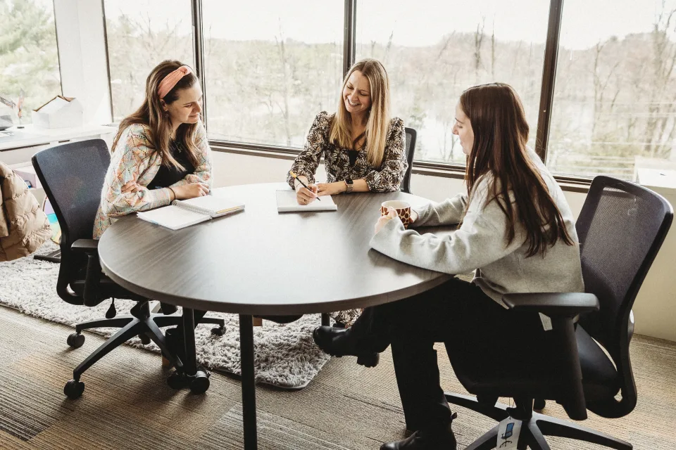 Students sitting around table in discussion