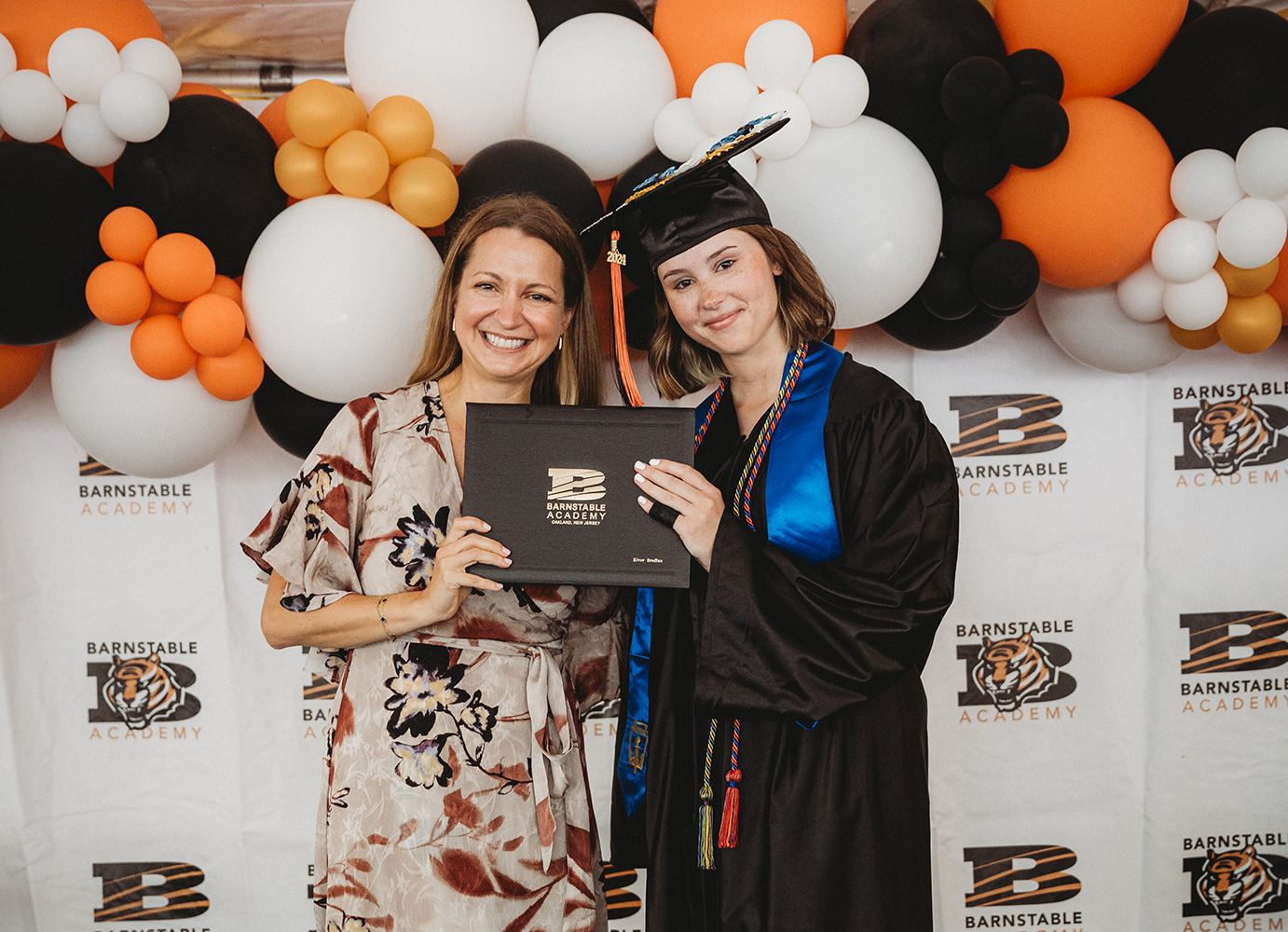 Student celebrating receiving diploma for graduation